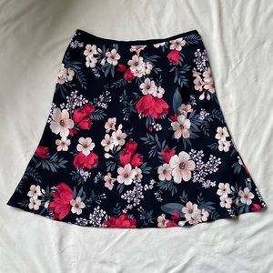 Ann Taylor mid-length skirt, size 12, navy w/ floral design.